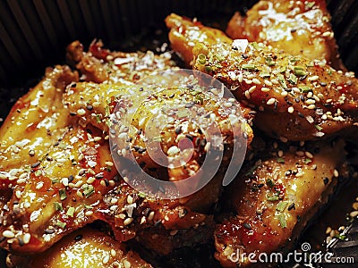 Macro close-up with Korean Chicken wings with sauce. ì¹˜í‚¨. Traditional asian food Stock Photo